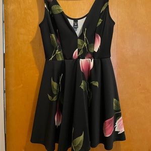 Black and floral romper. Super cute! Size 4. Super stretchy!